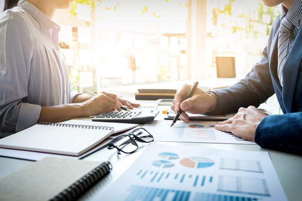 Consultoría corporativa 1 business man financial inspector secretary making report calculating checking balance internal revenue service inspector checking document audit concept